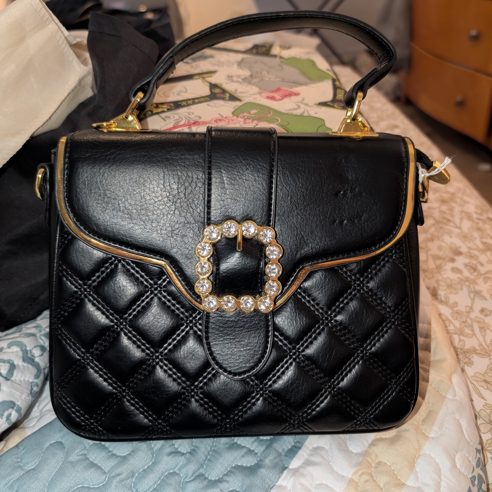 Elegant Black Quilted Handbag with Gold Accents